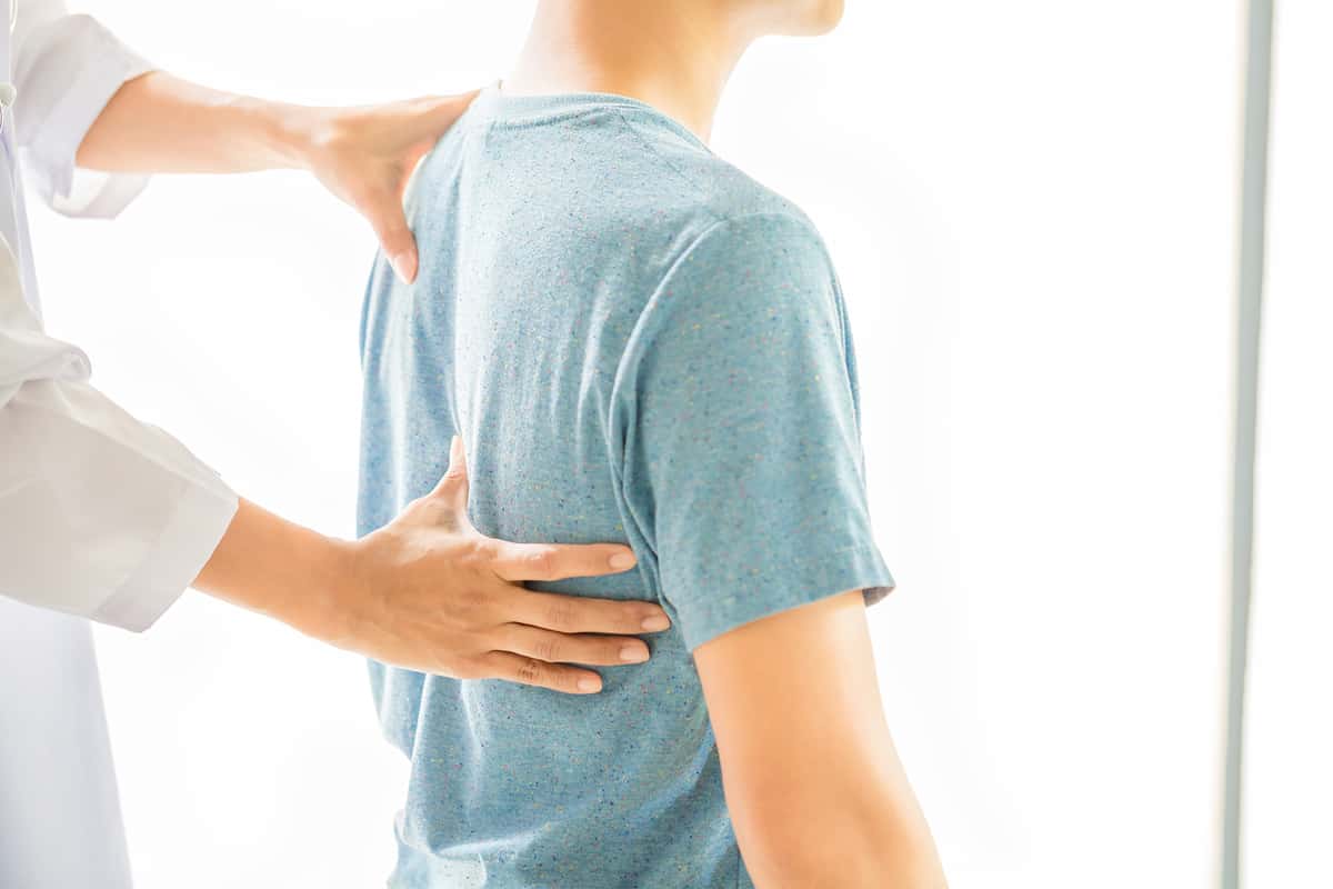 About Chiropratic chiropractor treating back pain